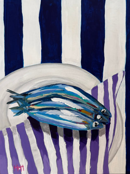 Sardines on purple napkin